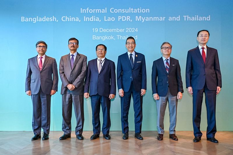 This handout picture taken and released by Thailand's Ministry of Foreign Affairs on 19 December 2024 shows (L-R) Foreign Secretary of the Republic of India Vikram Misri, Foreign Affairs Minister of Bangladesh Md. Touhid Hossain, Deputy Prime Minister and Union Minister for Foreign Affairs of Myanmar Than Swe, Minister of Foreign Affairs of Thailand Maris Sangiampongsa, Minister of Foreign Affairs of the Lao PDR Thongsavanh Phomvihane and Vice Foreign Minister of China Sun Weidong posing for a group photo during a six-nation regional meeting in Bangkok