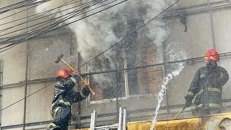 Fire fighters are working to douse the fire at Love Leen Cafe & Restaurant at sector-12 of Uttara on 20 December 2024