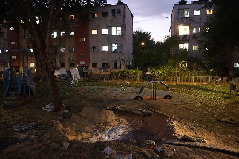 This picture shows a crater left behind in Tel Aviv as a result of a projectile fired from Yemen early on 21 December, 2024. Israel's military said on 21 December, it had failed to intercept a "projectile" launched from Yemen that landed in Tel Aviv, with the national medical service saying 16 people were lightly wounded.