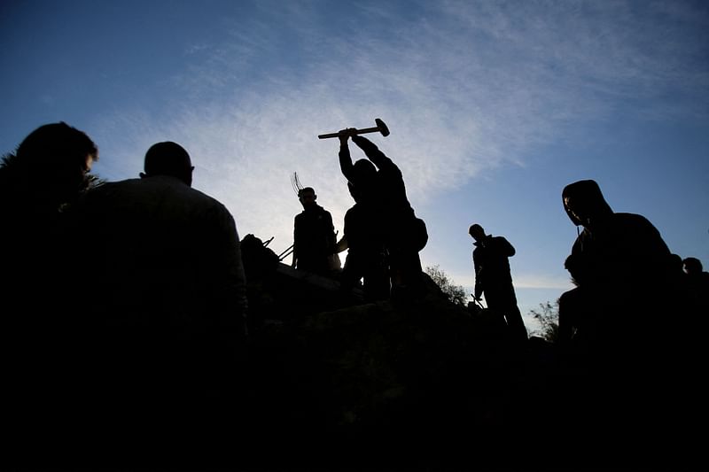 People search for survivors at the site of an Israeli strike that targeted the Abu Samra family home in Deir el-Balah in the central Gaza Strip on 22 December, 2024, amid the ongoing war between Israel and the Palestinian militant group Hamas.