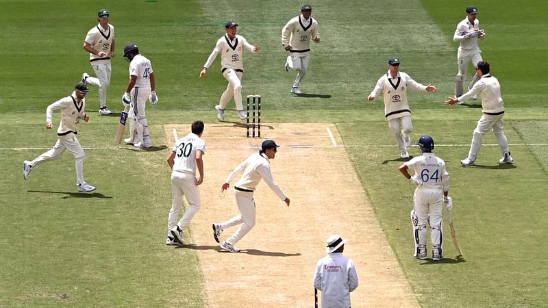 Australia celebrates dismissing Indian batsman Rohit Sharma (3/L) on the second day of the fourth cricket Test match between Australia and India at the Melbourne Cricket Ground (MCG) in Melbourne on 27 December, 2024