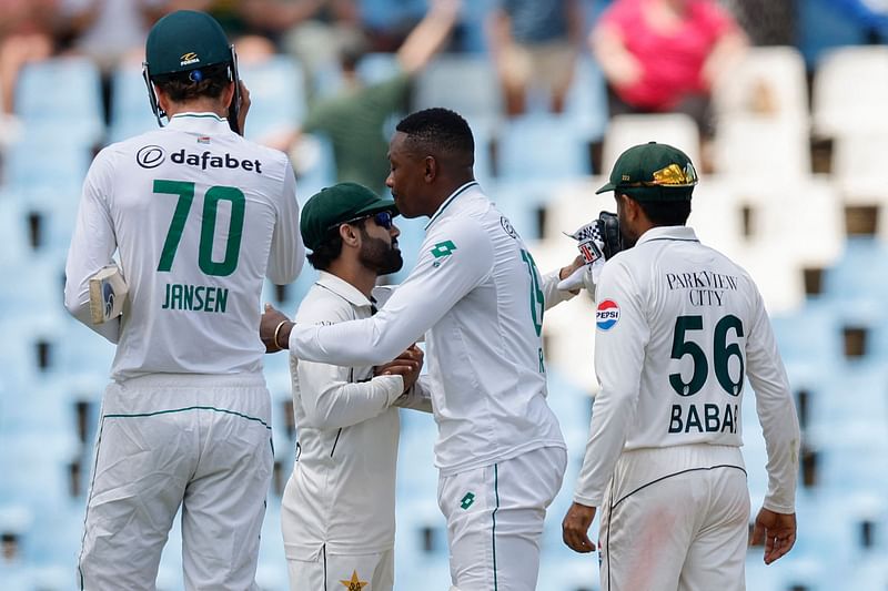 Pakistan’s Mohammad Rizwan (CL) congratulates South Africa’s Kagiso Rabada (CR) after South Africa won the match during the fourth day of the first cricket Test match between South Africa and Pakistan at SuperSport Park in Centurion on 29 December 2024