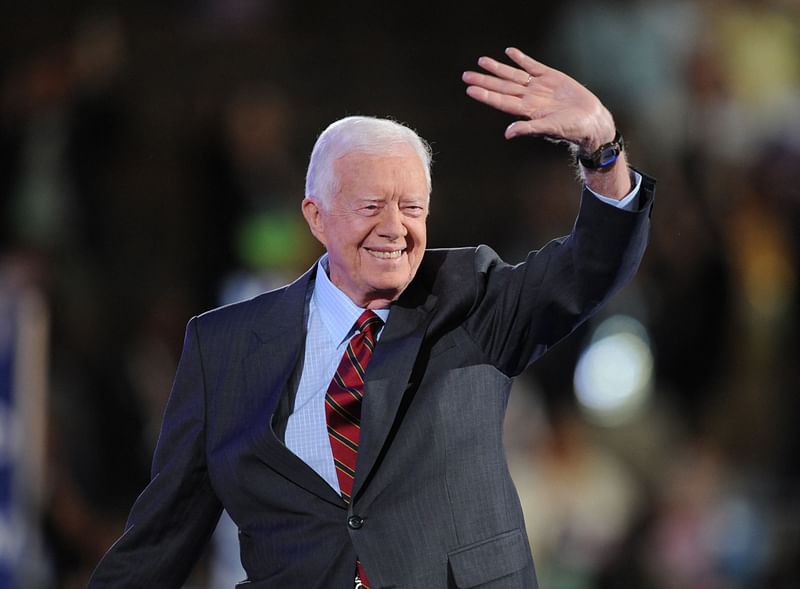 Former President Jimmy Carter waves to the crowd at the Democratic National Convention 2008 at the Pepsi Center in Denver, Colorado, on August 25, 2008