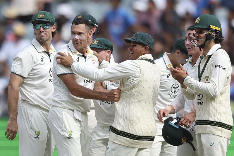 Australian players react to a DRS decision to dismiss India's Akash Deep on day five of the fourth cricket Test match between Australia and India at the Melbourne Cricket Ground (MCG) in Melbourne on 30 December, 2024