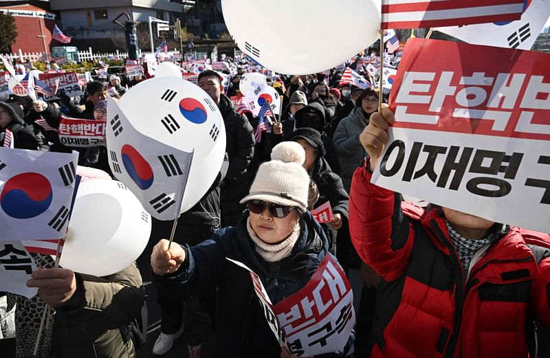 Supporters of impeached South Korea President Yoon Suk Yeol gather near the presidential residence in Seoul on December 31, 2024