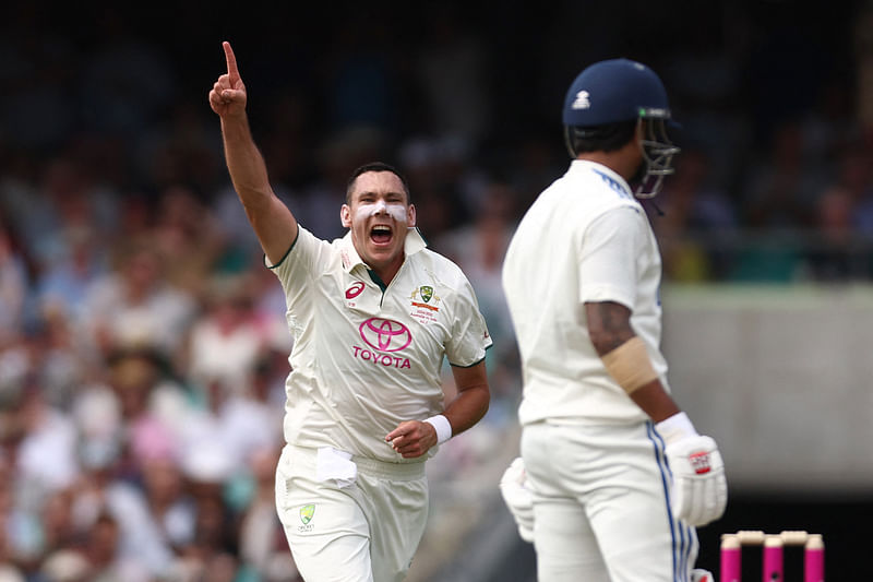 Australia’s Scott Boland (L) celebrates after dismissing India’s Nitish Kumar Reddy during day one of the fifth cricket Test match between Australia and India at the Sydney Cricket Ground on 3 January, 2025.