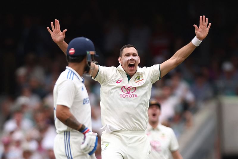 India’s Virat Kohli (L) watches as Australia’s Scott Boland appeals unsuccessfully for a LBW during day one of the fifth cricket Test match between Australia and India at the Sydney Cricket Ground on 3 January, 2025.