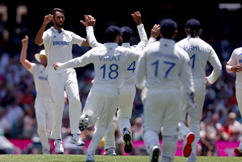 India’s Prasidh Krishna (L) reacts with teammates after dismissing Australia’s Steve Smith during day two of the fifth cricket Test match between Australia and India at The SCG in Sydney on 4 January, 2025