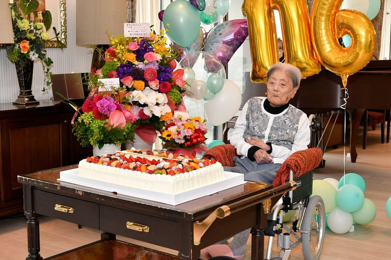 This handout file photo taken on 23 May 2024 and provided to AFP on August 22, 2024 by the Ashiya City government shows Japanese woman Tomiko Itooka as she celebrates her 116th birthday, in the city of Ashiya, Hyogo prefecture.