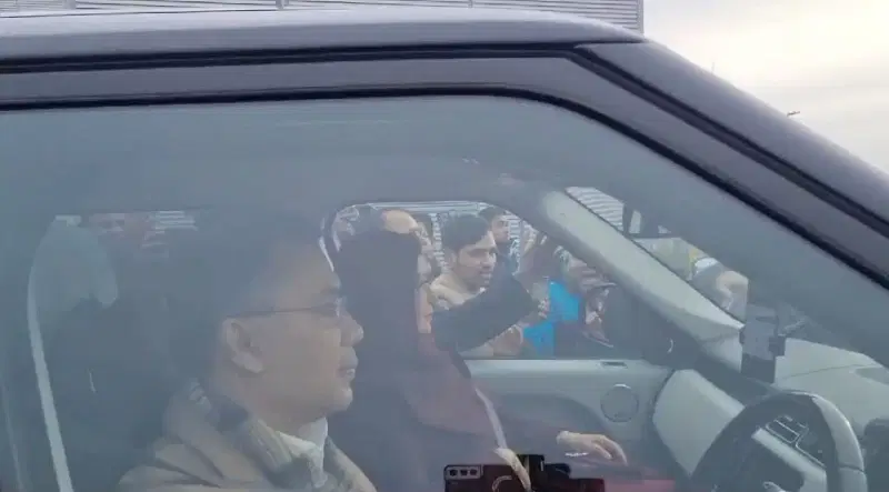 Tarique Rahman with his wife on the front passenger seat driving his mother to the hospital from the London airport on 8 January, 2024.