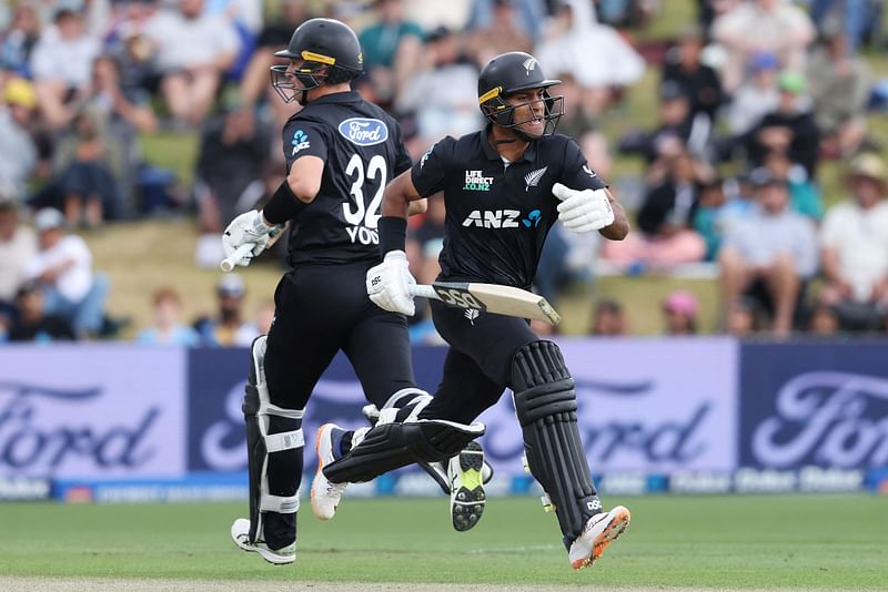 New Zealand’s Rachin Ravindra (R) and Will Young (L) make a run during the second one-day international cricket match between New Zealand and Sri Lanka at Seddon Park in Hamilton on 8 January 2025