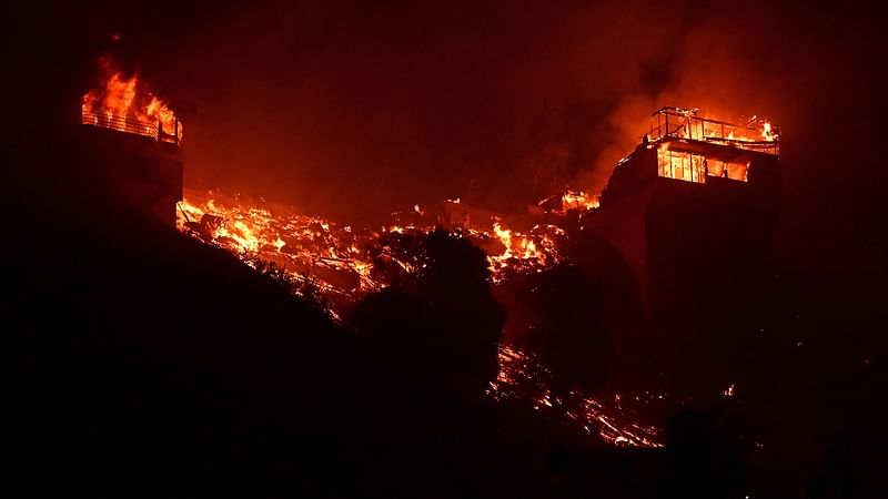 Structures burn along Pacific Coast Highway during the Palisades Fire in Malibu, California, on 8 January, 2025