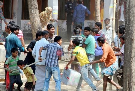 Miscreants snatch a ballot box at Golabariya Government Primary School polling centre of Brahmanpara upazila, Comilla on 15 March 2014.