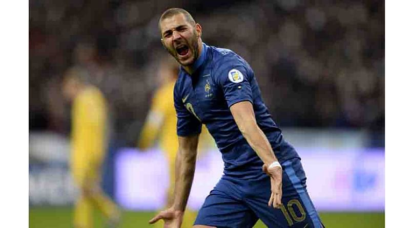 France's forward Karim Benzema celebrates after scoring his team's second goal during the 2014 World Cup qualifying play-off second leg football match between France and Ukraine at the Stade de France in Saint-Denis, outside Paris, on 19 November, 2013