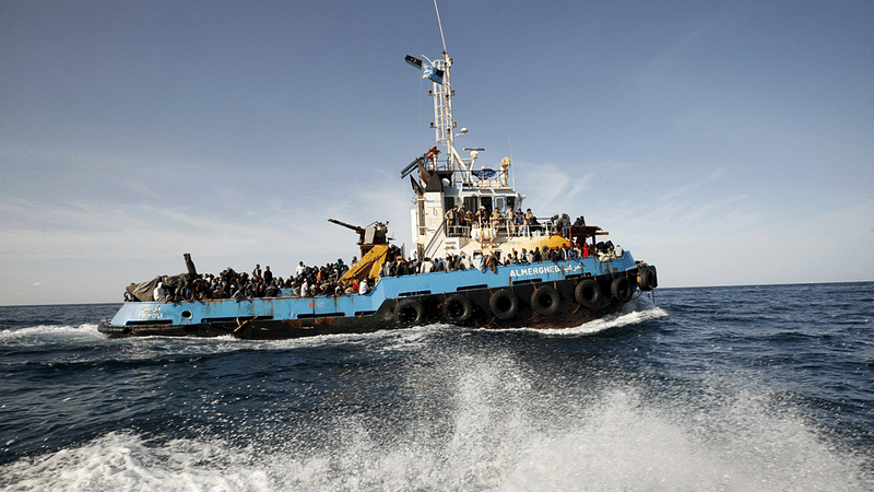 A Libyan Navy boat carries migrants back to the coastal city of Misrata on May 3, 2015. Nearly 5,800 migrants were plucked from boats off the coast of Libya and 10 bodies were recovered in less than 48 hours, Italy