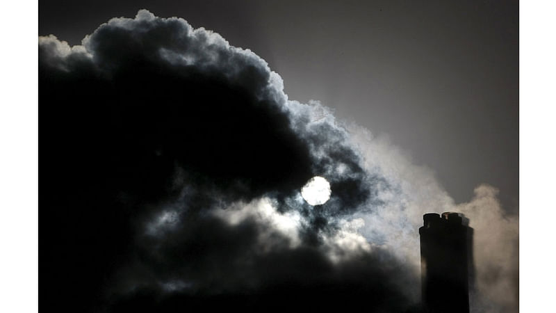 The sun is seen through the steam and other emissions coming from funnels of the brown coal Loy Yang Power Station in the Latrobe Valley near Melbourne in this December 15, 2008 file photo.