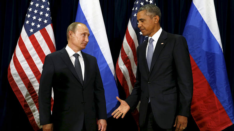 Former US president Barack Obama extends his hand to Russian president Vladimir Putin during their meeting at the United Nations General Assembly in New York on 28 September, 2015.