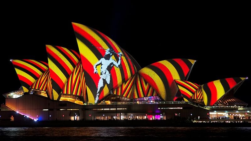 An image of an indigenous Australian man is projected onto the sails of the Sydney Opera House during the opening night of the annual Vivid Sydney light festival in Sydney, Australia, May 27, 2016. Photo: Reuters