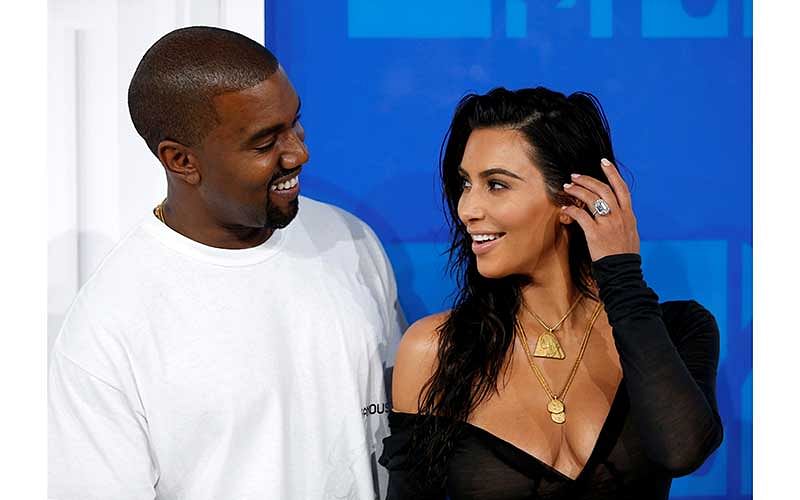 Kim Kardashian and Kanye West arrive at the 2016 MTV Video Music Awards in New York, U.S., August 28, 2016.