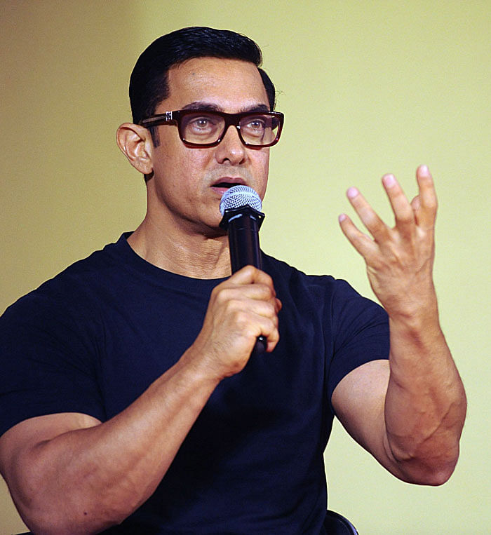 This file photo taken on 04 July, 2016 shows Bollywood actor Aamir Khan attending a poster launch of his upcoming biographical sports drama `Dangal` in Mumbai. Photo: AFP