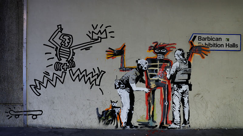 A mural painted by the artist Banksy is seen near the Barbican Centre in London.