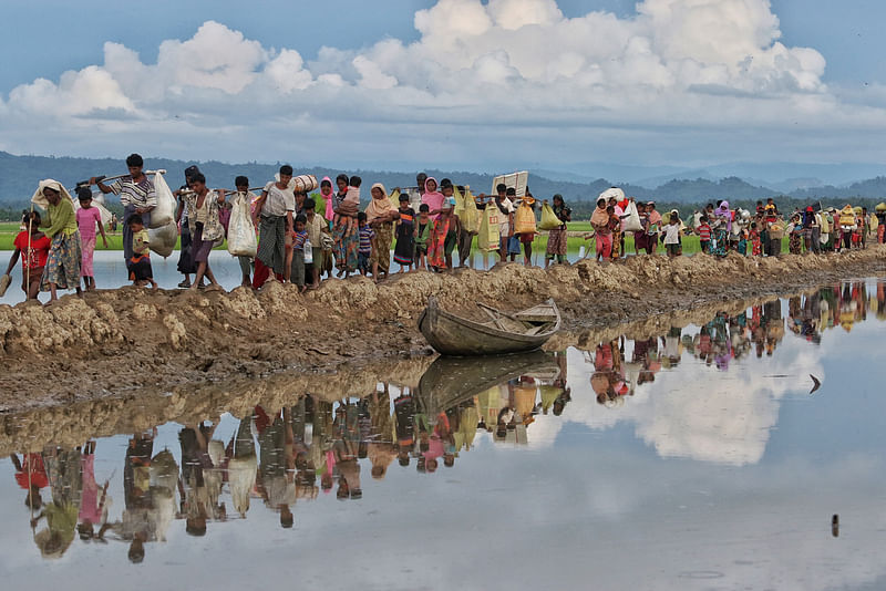 Weary Rohingya trudging from Myanmar's Rakhine state to Ukhia, Bangladesh.