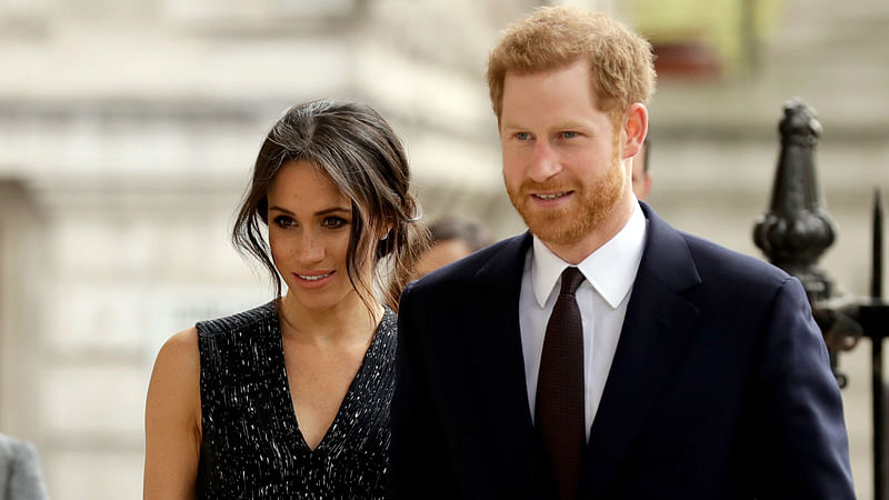 Britain`s prince Harry and his wife Meghan Markle