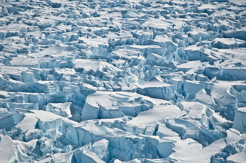 Hand-out photo taken on 8 January 2011 and received on 12 June 2018 via the Nature website shows summer clouds swirling in around the Staccato Peaks of Alexander Island, Antarctic Peninsula. Antarctica has lost a staggering three trillion tonnes of ice since 1992, according to a landmark study published on 13 June 2018 that suggests the frozen continent could redraw Earth`s coastlines if global warming continues unchecked