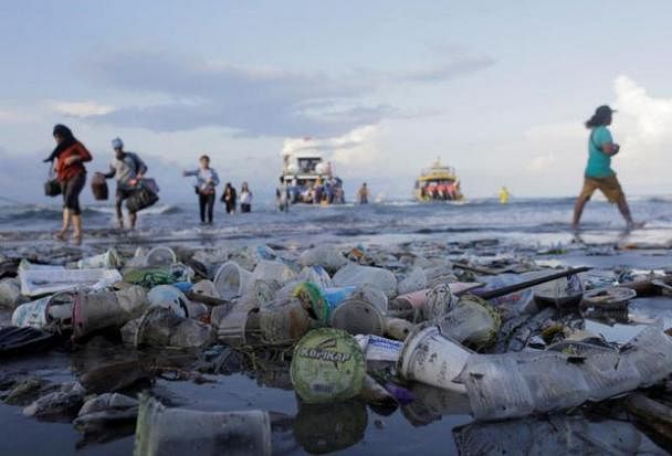 Plastic trash pollutes the beach in Sanur, Denpasar, Bali, Indonesia.