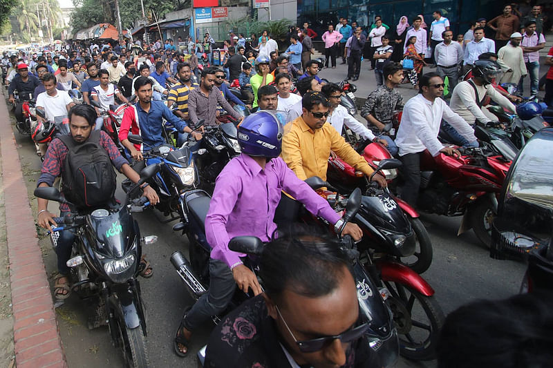 Members of Bangladesh Awami League hold a motorcycle rally on the occasion of selling nomination forms for 11th parliamentary elections at Dhanmondi Road-2 in Dhaka on 12 November