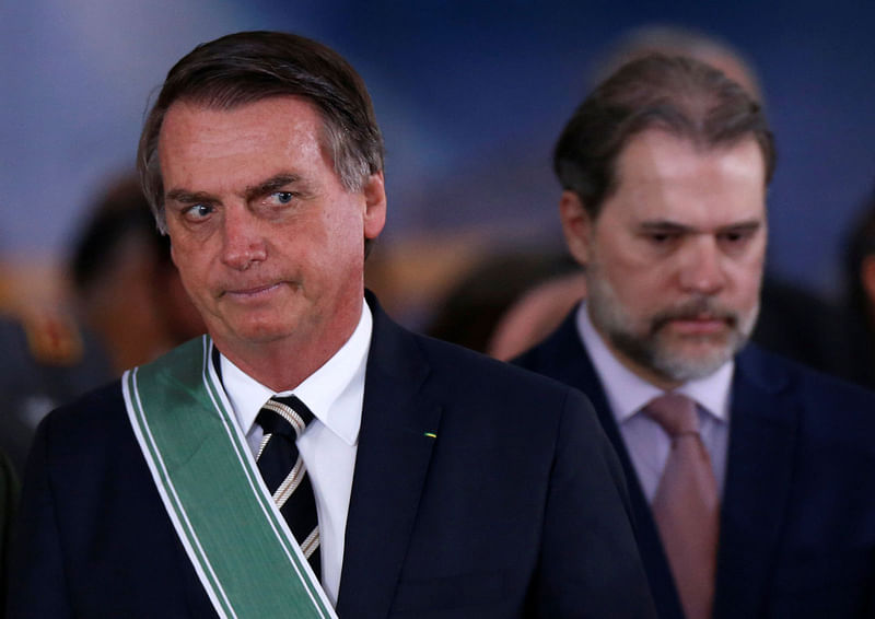 Brazil`s president Jair Bolsonaro and president of the Supreme Federal Court Dias Toffoli attend a swearing-in ceremony for the country`s new army commander in Brasilia, Brazil on 11 January. Photo: Reuters