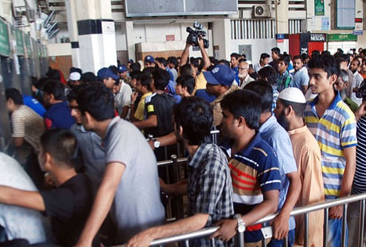 People wait in queues for advanced train tickets