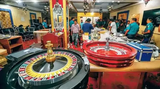 Police conducting a raid in an illegal casino of Dhaka