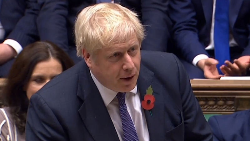 A video grab from footage broadcast by the UK Parliament`s Parliamentary Recording Unit (PRU) shows Britain`s prime minister Boris Johnson speaking in the House of Commons in London on 28 October, after losing a vote for an Early Parliamentary General Election.