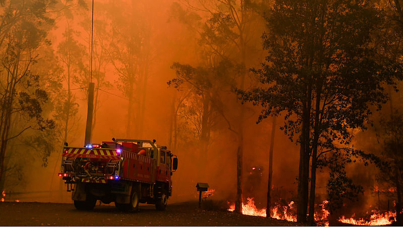 Fire trucks are seen during a bushfire in Werombi, 50 km southwest of Sydney, Australia, on 6 December 2019