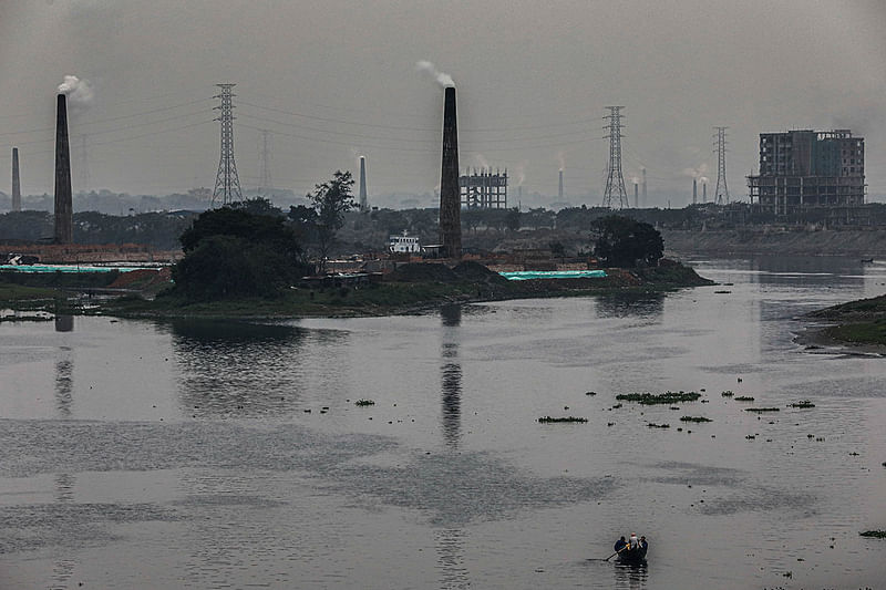 Smokes belch out of brick kiln chimneys at Shyamlasi, Keraniganj, on the outskirts of Dhaka on 3 January 2019. According to the environment department of Bangladesh 58 per cent air pollution of the capital are caused by brick kilns