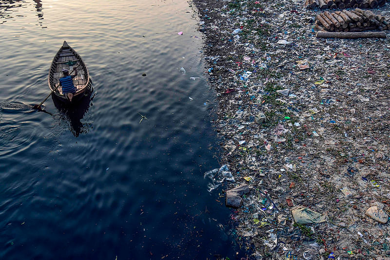 Plastic bags floatin the Buriganga river in Dhaka on 21 January 2020.