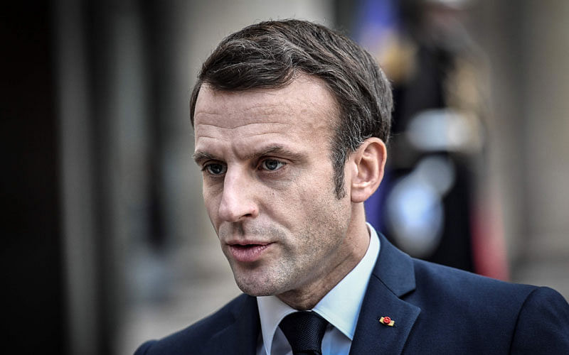 France’s president Emmanuel Macron speaks to journalists on the sidelines of a meeting with the Argentinian president at the Elysee presidential Palace in Paris on 5 February.