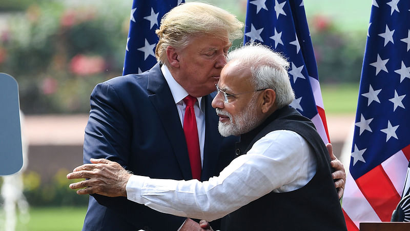 US President Donald Trump (L) shakes hands with India`s Prime Minister Narendra Modi during a joint press conference at Hyderabad House in New Delhi on 25 February 2020.