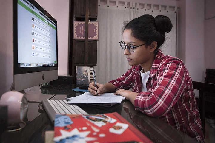 17-year-old firefighter Spondon takes online exams as part of distance learning as schools close in Bangladesh