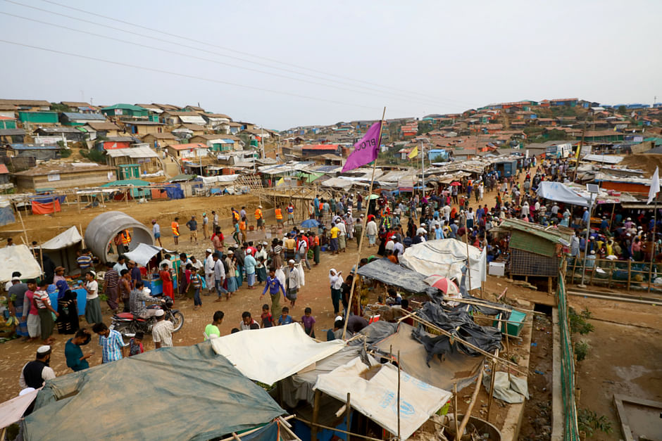 Rohingya refugees gather at a market inside a refugee camp in Cox's Bazar, Bangladesh, on 7 March 2019