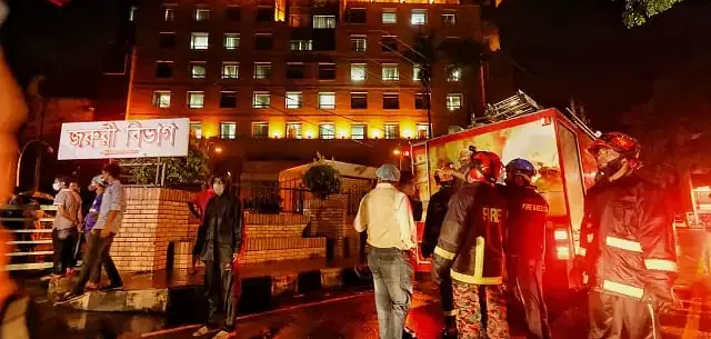 Fire service men work to extinguish fire at United Hospital