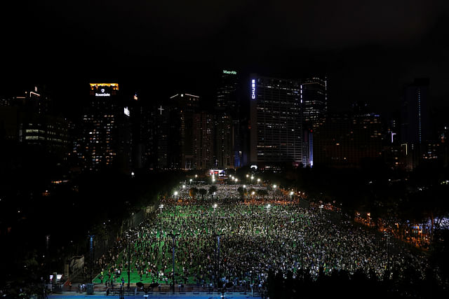 Protesters take part in a candlelight vigil to mark the 31st anniversary of the crackdown of pro-democracy protests at Beijing's Tiananmen Square in 1989, after police rejects a mass annual vigil on public health grounds, at Victoria Park, in Hong Kong, China on 4 June 2020