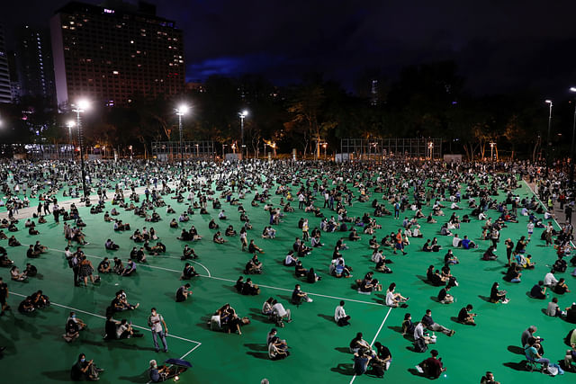 Protesters take part in a candlelight vigil to mark the 31st anniversary of the crackdown of pro-democracy protests at Beijing's Tiananmen Square in 1989, after police rejects a mass annual vigil on public health grounds, at Victoria Park, in Hong Kong, China on 4 June 2020