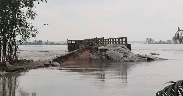 Floodwater washes away roads