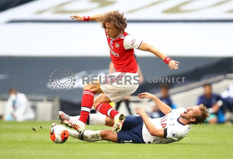 Tottenham Hotspur's Harry Kane in action with Arsenal's David Luiz