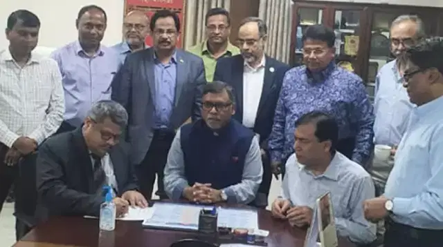 Md Shahed is signing the MoU while health minister Zahid Maleque and DG Abul Kalam Azad look on