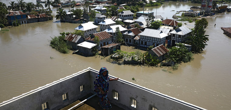 Houses located beside the Padma river are seen flooded as the flood situation worsens in Munshiganj district, on the outskirts of Dhaka, outskirts of Dhaka, Bangladesh, 25 July 2020.