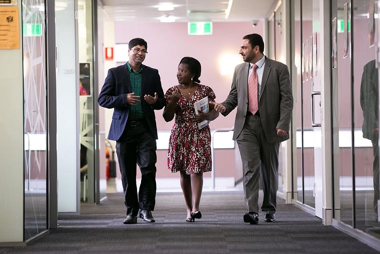 Moazzem Hossain with his colleagues. 