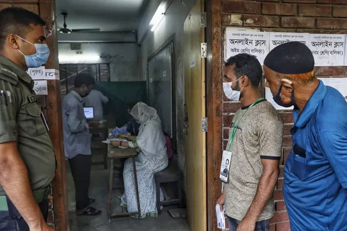 Voting at the Ideal School and College centre at Jatrabari on 17 October
